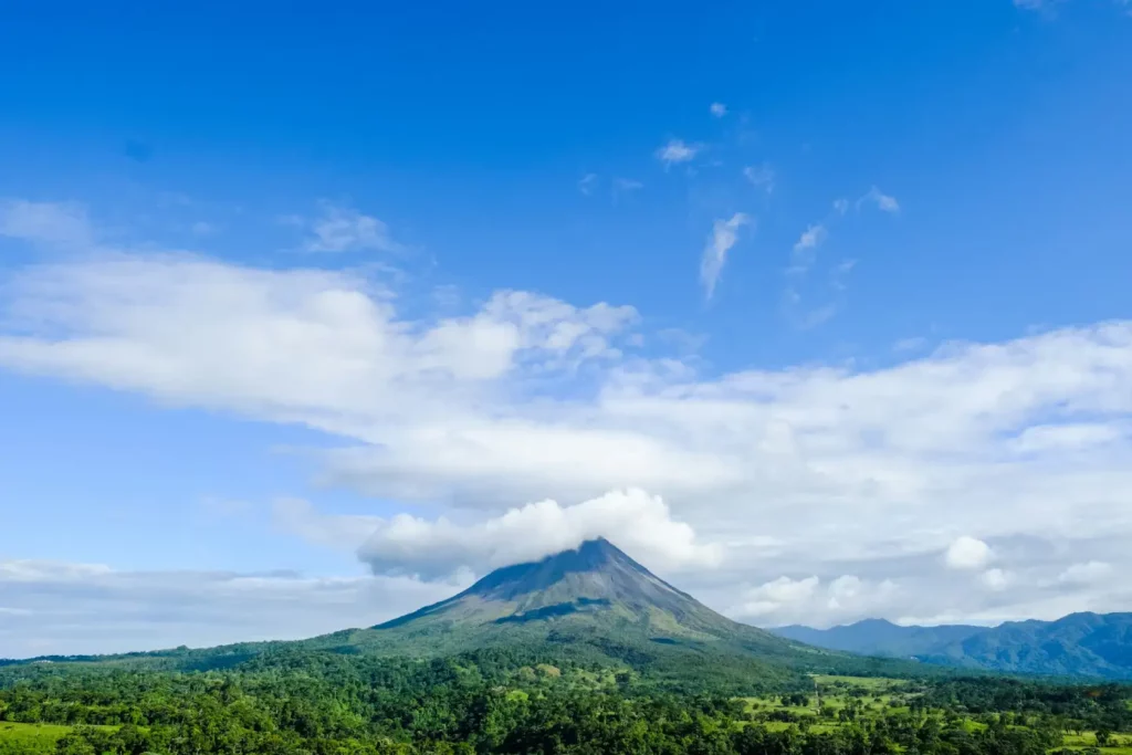 Arenal volcano with clouds above it
