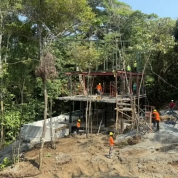 Elevated steel framing and reinforced concrete slab construction at Manuel Antonio Tree House Villa during upper-level structural development.