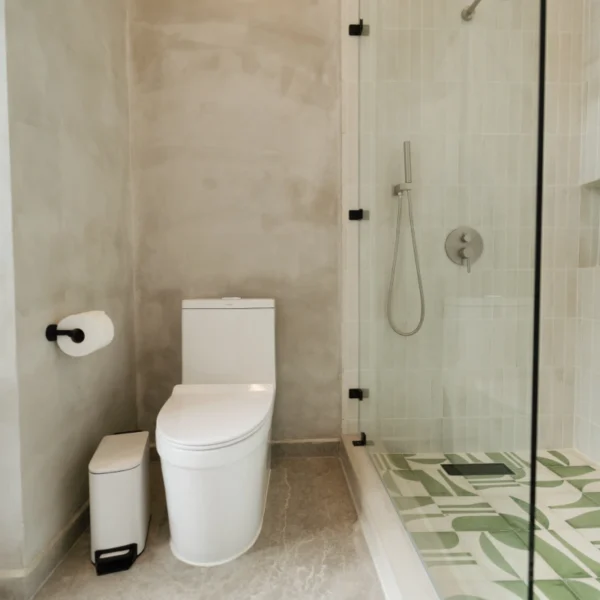 Modern jungle bathroom at Manuel Antonio Tree House Villa with contemporary fixtures and natural surroundings.