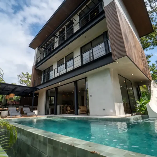 Private plunge pool with waterslide at Manuel Antonio Tree House Villa surrounded by elevated jungle views.