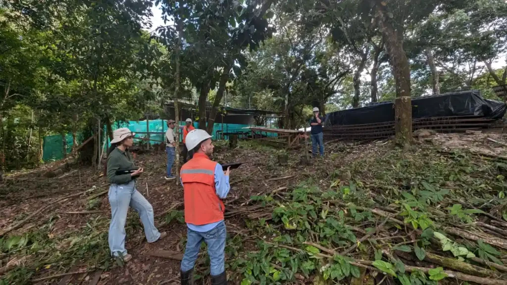 Engineering team conducting pre-construction site assessment at Manuel Antonio Tree House Villa prior to foundation and structural development.