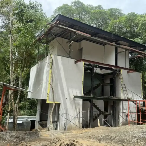 Structural enclosure completed with roofing installation at Manuel Antonio Tree House Villa.